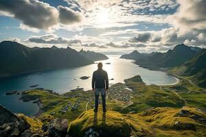 Man standing on the top of a mountain and enjoying the view AI generated photo