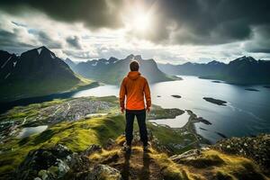 Man standing on the top of a mountain and enjoying the view AI generated photo