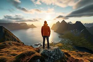 Man standing on the top of a mountain and enjoying the view AI generated photo