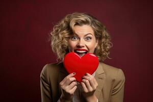 retrato de un contento mujer con rojo corazón en un rojo fondo.de san valentin día concepto ai generado foto