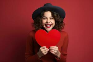 Portrait of a happy woman with red heart on a red background.Valentine's Day Concept AI generated photo