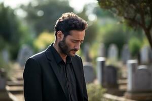 Portrait of a sad and depressed man in a black coat on the background of a cemetery.Funeral Concept AI generated photo