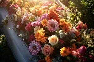 Colorful flowers on the grave in the cemetery, funeral concept. AI generated photo