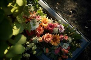 Colorful flowers on the grave in the cemetery, funeral concept. AI generated photo