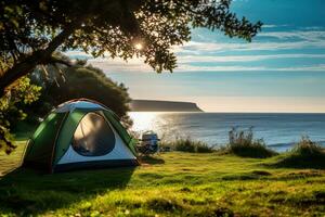 Camping tent and camping equipment on green grass with sea view background AI generated photo