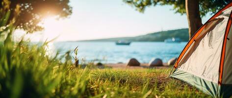 Camping tent and camping equipment on green grass with sea view background AI generated photo