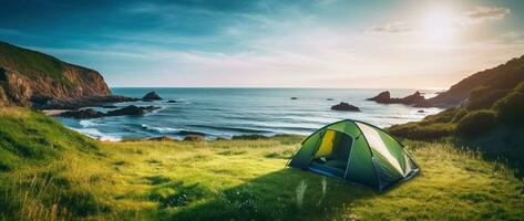 Camping tent and camping equipment on green grass with sea view background AI generated photo