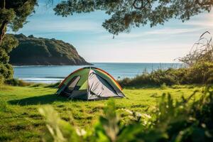 Camping tent and camping equipment on green grass with sea view background AI generated photo