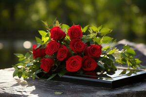 Red roses on black granite tombstone in the park, funeral concept AI generated photo