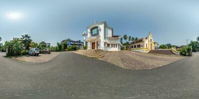 full hdri 360 panorama of modern catholic church in jungle among palm trees in Indian tropic village in equirectangular projection with zenith and nadir. VR AR content photo