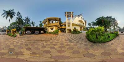 full hdri 360 panorama of modern catholic church in jungle among palm trees in Indian tropic village in equirectangular projection with zenith and nadir. VR AR content photo