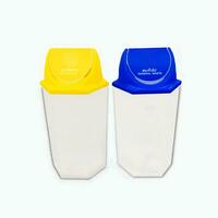 Yellow trash bin recycling and blue bins general waste isolated on white background with Clipping Path photo