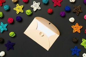 Top view of envelope on black background. New Year decorations. Christmas holiday concept photo