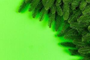 Top view of colorful festive background made of fir tree branch. Christmas holiday concept with copy space photo