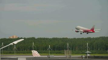 SAINT PETERSBURG, RUSSIA JULY 26, 2022 Commercial airplane Airbus A319, RA 73212 of Rossiya taking off, climbing at Pulkovo airport, St. Petersburg. Travel concept. video