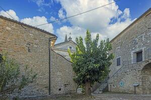 Picture from the town of Groznjan with idyllic cobbled streets and buildings made of natural stone photo