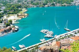 Beautiful bay withwith yachts and boats in sunny summer day. View from above. Selective focus. photo