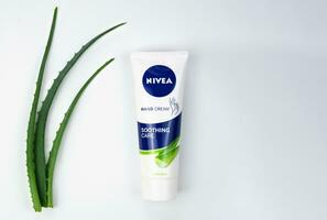 Kyiv, Ukraine - 18 July 2023. Soothing hand cream Nivea with aloe vera on a white background. Natural cosmetic product. Top view. Close-up. Copy space. photo