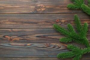 Christmas holiday background with copy space for advertising text. Fir branches on color background . Flat lay, top view photo