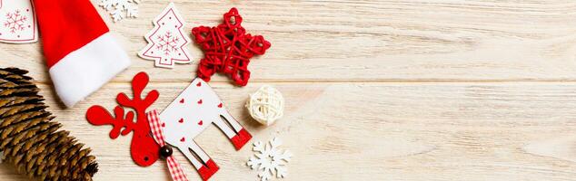 Banner top view of Christmas decorations and toys on wooden background. Copy space. Empty place for your design. New Year concept photo