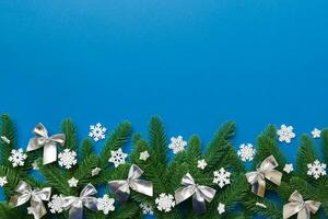 Christmas background with fir branches and Christmas decor. Top view, copy space for text photo