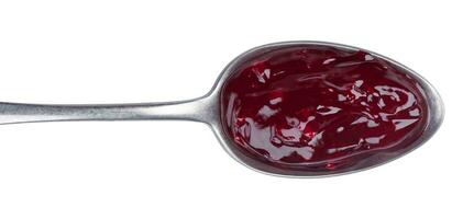 Spoon of red jam isolated on white background, top view photo