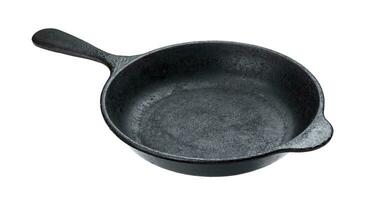 Old cast iron pan isolated on white background with clipping path photo