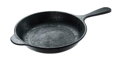 Old cast iron pan isolated on white background photo