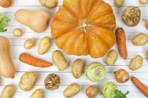 Autumn vegetables on white background photo