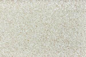 Rice texture. Polished rice groats background photo