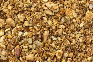 Granola with nuts texture, muesli background photo