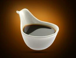 Soy sauce in bowl isolated, shoyu closeup in dish photo