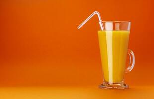 Glass of orange juice isolated on colour orange background with copy space for text photo