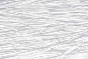 Crumpled white paper background photo