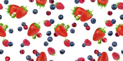 Seamless pattern of flying berries isolated on white background with clipping path, different falling wild berry fruits photo