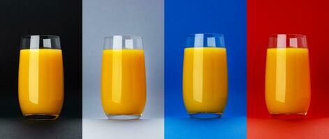 Glass of orange juice isolated on different color backgrounds photo