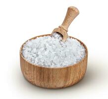 Sea salt in wooden bowl with scoop isolated on white background photo