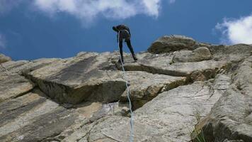 Rappelling on Rock. Descending on Rope. Slow Motion video