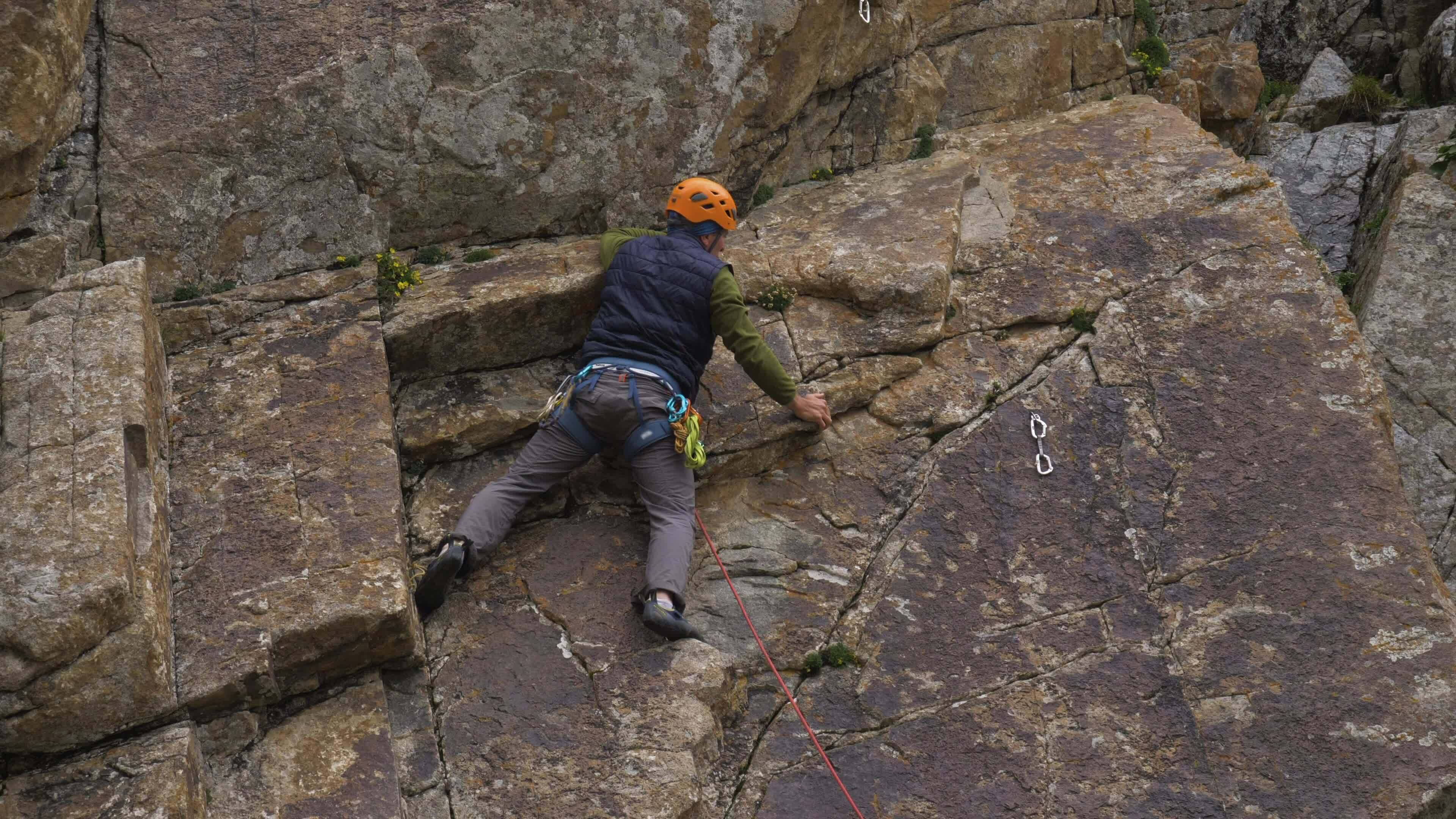 Rock Climbing. Man Puts the Rope in Quickdraw. Slow Motion 34608934