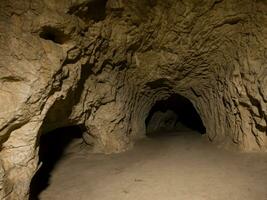 ancient stone walls of the cave in cappadocia, turkey photo