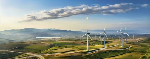 Environmentally installation of photovoltaic power plant and wind turbine farm situated by landfill.Solar panels farm built on a waste dump and wind turbine farm. Renewable energy source photo