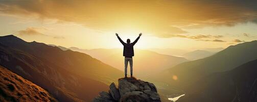 Positive man celebrating with arms raised up at Mountain landscape at sunset, Generative AI photo