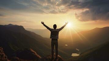 Positive man celebrating with arms raised up at Mountain landscape at sunset, Generative AI photo
