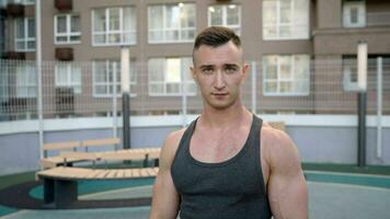 Strong athlete gaze. Closeup face of a young male athlete. Exhausted athlete after training. photo