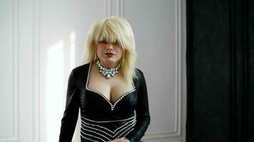 A man with false breasts, dressed as a woman. Drag Artist. Portrait of a drag queen. photo