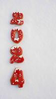 Numbers 2024 in the snow. New Year's background with numbers 2024 on a beautiful New Year's snowy background. Banner, greeting card for Christmas 2024. photo