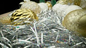 Christmas toys and garlands on a light background. New Year's toys closeup. photo