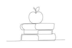 un manzana en un apilar de libros vector