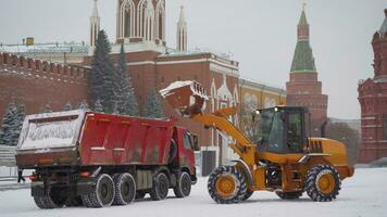 transport equipment clears the red square in Moscow from snow. Red Square in Moscow. snow machines eliminates the effects of snowfall photo