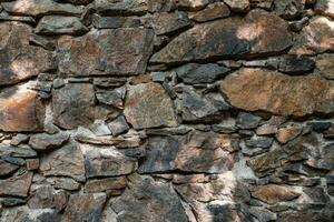 Stone wall. Outdoor background natural stone photo